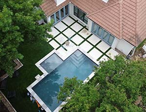 Arial view of pool and pavors and grasswork